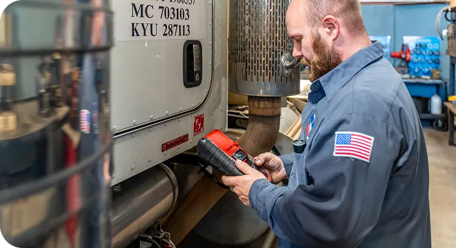 auto-mechanic-checking-truck-garage-servicing-repairing-trucks-large-garage-car 1 auto mechanic checking truck garage servicing repairing trucks large garage car 1